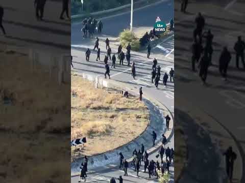 A large group of masked protesters has gathered at the Port of Dover