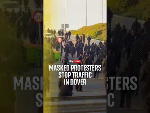 Masked protesters stop traffic in Dover