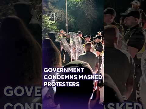 Government condemns “intimidating and thuggish” masked protesters