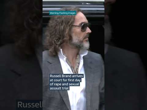 Russell Brand arrives at court for first day of rape and sexual assault trial