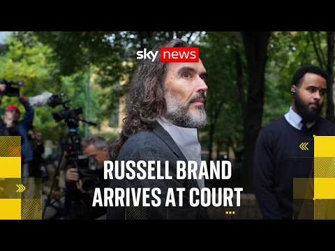 Russell Brand arrives at court ahead of trial