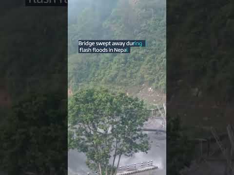 Bridge swept away during flash floods in Nepal