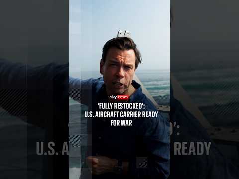 Sky News watches missiles loaded on to US aircraft carrier in Middle East