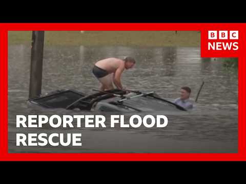 Reporter swims through flood to rescue man from sinking car | BBC News
