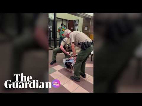 Woman shoved to the ground and arrested during Utah county datacenter hearing