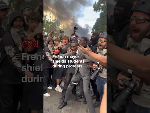 French mayor shields students during protests