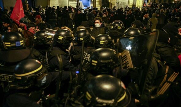 Moment French riot cops clear out hundreds of asylum seekers who took over Paris theatre