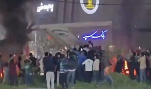 Iranians celebrate in the street after death of Ayatollah as they pull down statue