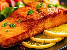 Salmon can come out the oven tastier if topped with 1 common ingredient before cooking